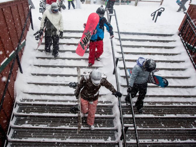 Skiers and snowboarders come back from the slopes at Bear Mountain Lodge one day after resort shut down because of a massive manhunt for murder suspect Christopher Dorner.