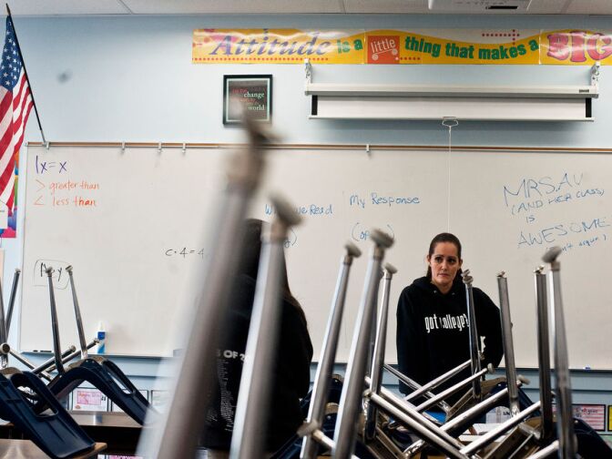 Kimberly Av, who teaches the seventh and eighth grades, talks to students after school in her new classroom.