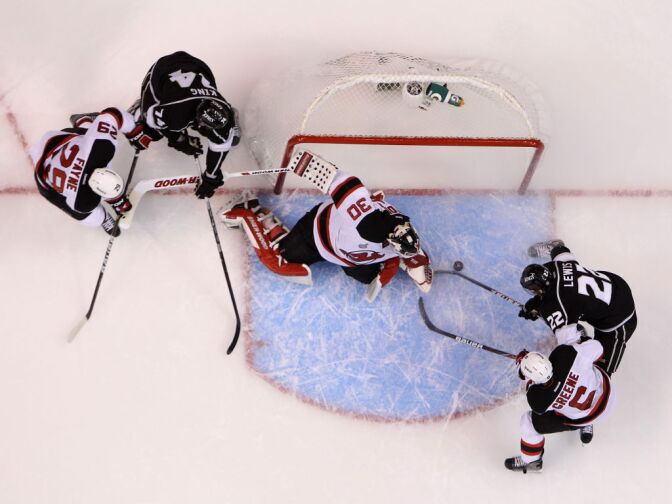 Trevor Lewis #22 of the Los Angeles Kings scores against goaltender Martin Brodeur #30 of the New Jersey Devils in the first period of Game Six of the 2012 Stanley Cup Final at Staples Center on June 11, 2012 in Los Angeles, California.