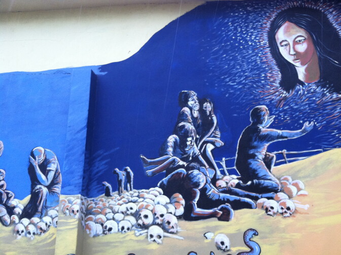 A mural that pays tribute to the migrants who make the perilous journey across the desert decorates a wall in the center of Altar.