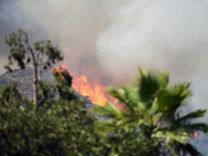 The Brand Fire burns down a hillside near homes in Glendale Sunday afternoon. 

The Brand Fire burns near Glendale and Burbank on Sunday, June 22nd, 2014. No evacuations were in place and the blaze had burned an estimated 75 acres by 6 p.m.