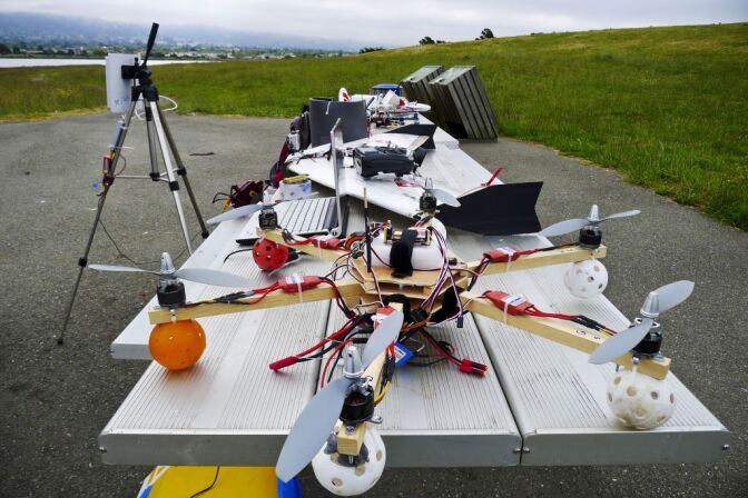 Researchers at the University of California, Davis are testing the use of small unmanned helicopters for pesticide spraying at farms and vineyards. (Photo: Hi-tech hobbyists Andreas Oesterer and Mark Harrison line up their homemade drones in Berkeley, Calif.)