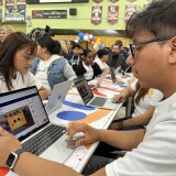 Two high school seniors test out LAUSD's new AI platform "Ed" at the Edward R. Roybal Learning Center.