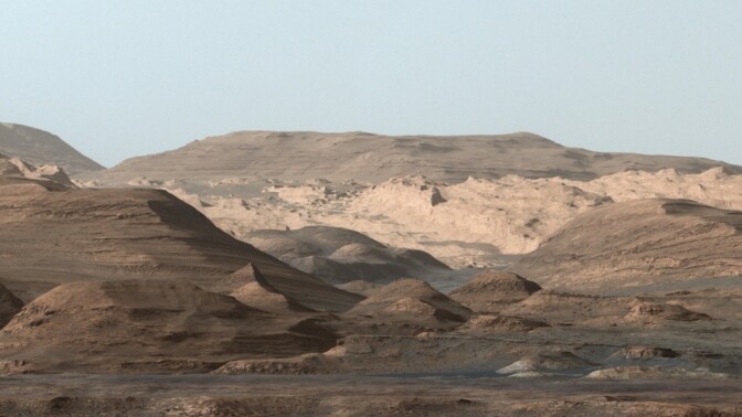 Mars's massive Mount Sharp may have formed billions of years ago as water carried sand and silt into the center of a large crater.