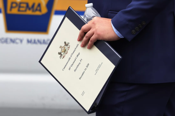 A person holding a folder with a white piece of paper