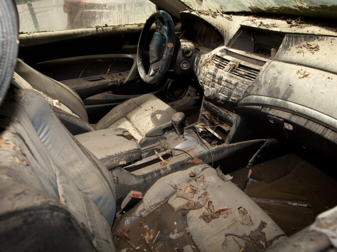 The interior of a vehicle trapped in a UCLA parking garage is filled with mud and debris after a broken water main flooded parts of campus.