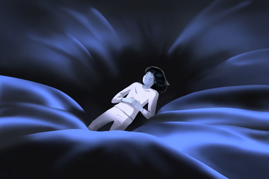 An illustrated person with long dark hair lies in the center of a satin fabric with their arms crossed.