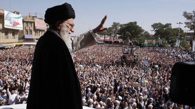 Iran's supreme leader, Ayatollah Ali Khamenei, waves to the crowd in a public gathering Tuesday during his visit to the city of Qom, 78 miles south of the capital Tehran. His trip is widely seen as an attempt to shore up his own status and legitimacy after last year's contentious presidential elections, in which he supported President Mahmoud Ahmadinejad.