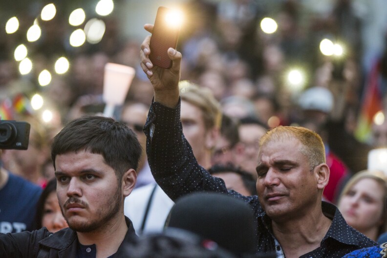 Thousands attend a vigil on Monday, June 13, 2016 at Los Angeles City Hall memorializing those who died in Sunday's attack in Orlando.