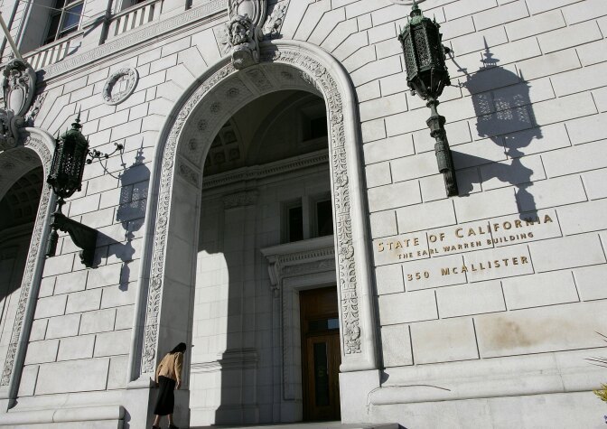 SAN FRANCISCO - JANUARY 22:  A woman walks into the State of California Earl Warren building January 22, 2007 in San Francisco, California. The U.S. Supreme court threw out California's sentencing law on Monday, a decision that could reduce sentences for thousands of inmates in the California State correctional facilities.  (Photo by Justin Sullivan/Getty Images)