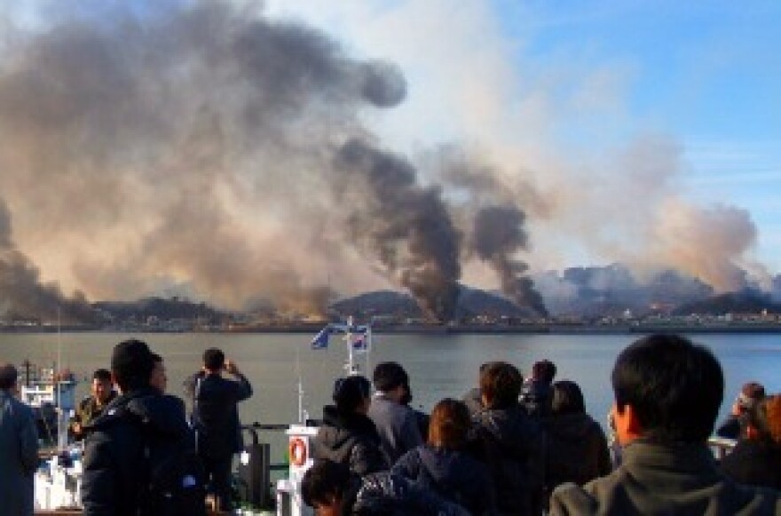 Huge plumes of smoke rising from Yeonpyeong island in the disputed waters of the Yellow Sea on November 23, 2010.