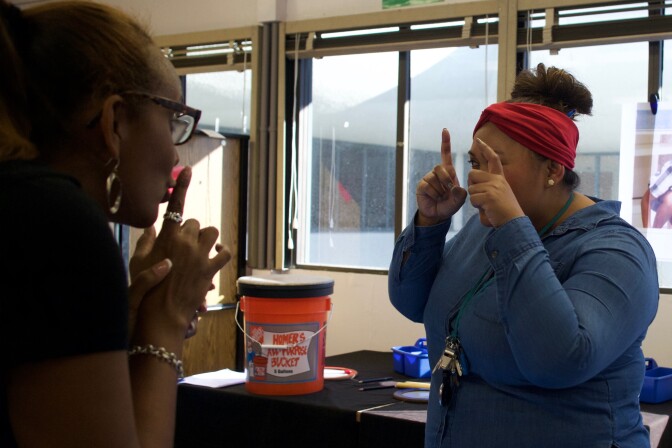 Teachers at Florence Griffith Joyner practice a lesson during a professional development workshop.