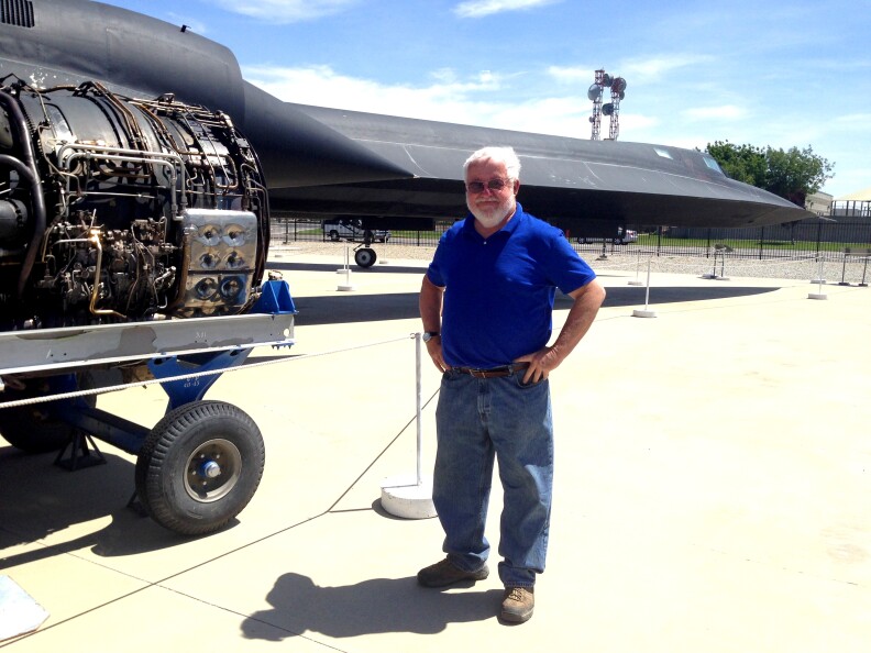 Bill “Flaps” Flanagan stands in front of an SR-71 Blackbird at the Blackbird Airpark in Palmdale. Flanagan flew the Blackbird for five years. 

