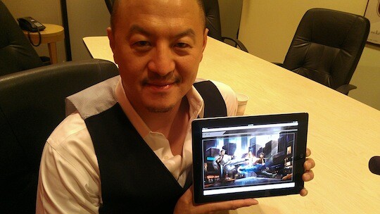 Peter Shiao, CEO and founder of Orb Media Group and organizer of the US-China Film Summit, showcasing a production illustration for his film, "The Legend of 18."