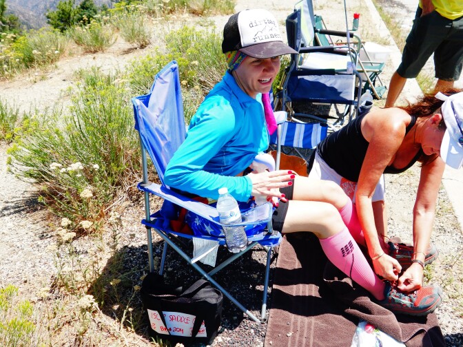                                Ultrarunner Martine Sesma uses a small handheld breast pump at about mile 26 of a 100-mile trail race from Wrightwood to Altadena. The mother of two boys, ages 2 and 6, she has been breastfeeding since before she began running. She discards the milk and rinses the pump so that it's ready in a few hours at her next aid station.