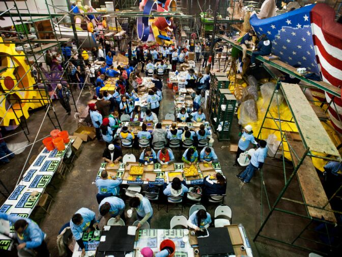 The Rosemont Pavilion next to the Rose Bowl, which houses Phoenix Decorating Company's floats, is bustling on Thursday evening, days before the parade on New Year's Day.