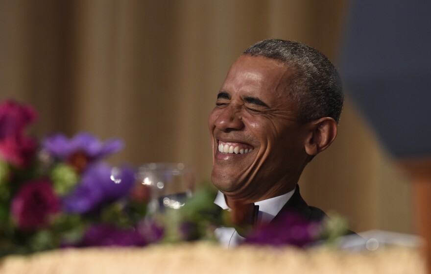 President Barack Obama laughs as he listens to Larry Wilmore, the guest host from Comedy Central, speak at the annual White House Correspondents' Association dinner at the Washington Hilton in Washington, Saturday, April 30, 2016. (AP Photo/Susan Walsh)