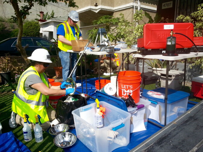 A crew tests soil from Grace and Everett Potvin's yard. 