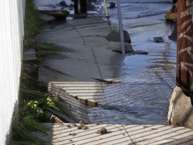 after an 18-inch main burst in Hollywood early Wednesday morning, Feb. 18, 2015 releasing a torrent of water onto residential streets and submerging cars.