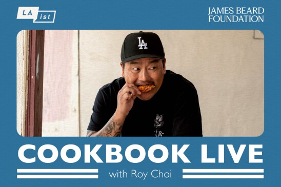 Promotional image with a blue frame in the frame is a photograph of Roy Choi wearing a black t-shirt, and a black Dodger’s hat.  Roy Choi is pictured eating a chicken wing.  On the lower bottom part of the frame is reads “Cookbook Live.” The top left corner of the frame has an LAist logo and the top right corner of the frame has The James Beard Foundation logo. 