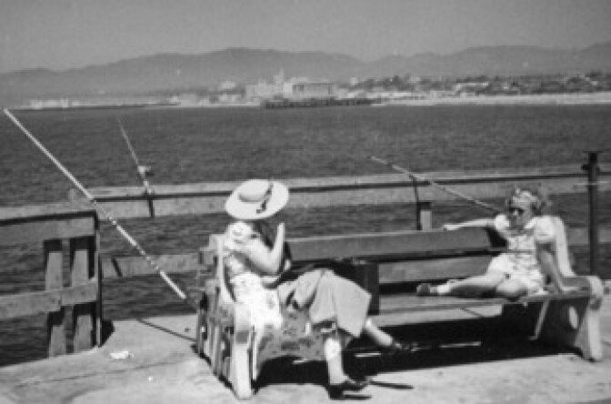 In this undated photo from the LA Public Library's fantastic online photo archive, a child captures Off-Ramp correspondent Hank Rosenfeld's disgust at the way officials treat the people who enjoy the free concerts at the Santa Monica Pier from blankets on the sand. 