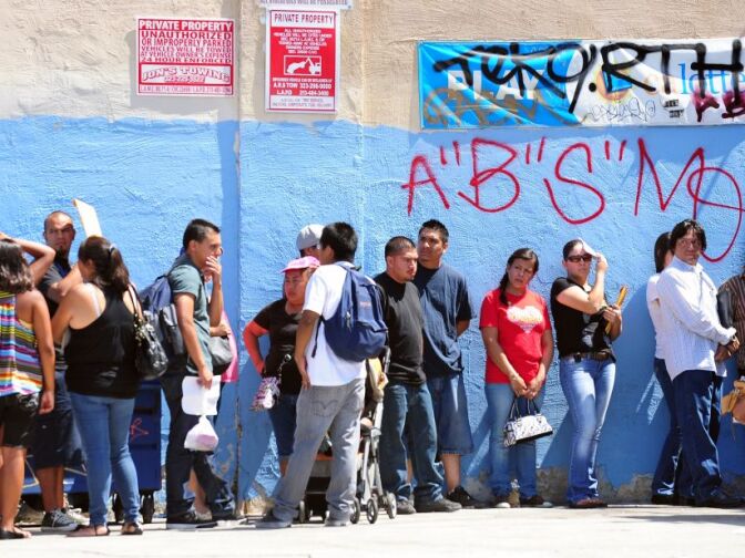 This August 15, 2012 file photo shows young people waiting in line to enter the Coalition for Humane Immigrant Rights of Los Angeles (CHIRLA) office in California, on the first day of the Deferred Action for Childhood Arrivals (DACA) program. Democratic US President Barack Obama failed on his promise of immigration reform, and Republican challenger Mitt Romney has employed harsh rhetoric against illegal immigrants. Now both need the acquittal of Hispanics who feel disillusioned by one and threatened by the other.