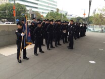 Los Angeles police recruits get ready for a graduation ceremony on Friday, July 8, 2016 outside the department's headquarters. In his speech, LAPD Chief Charlie Beck was expected to address the deadly sniper attacks targeting officers in Dallas on Thursday.