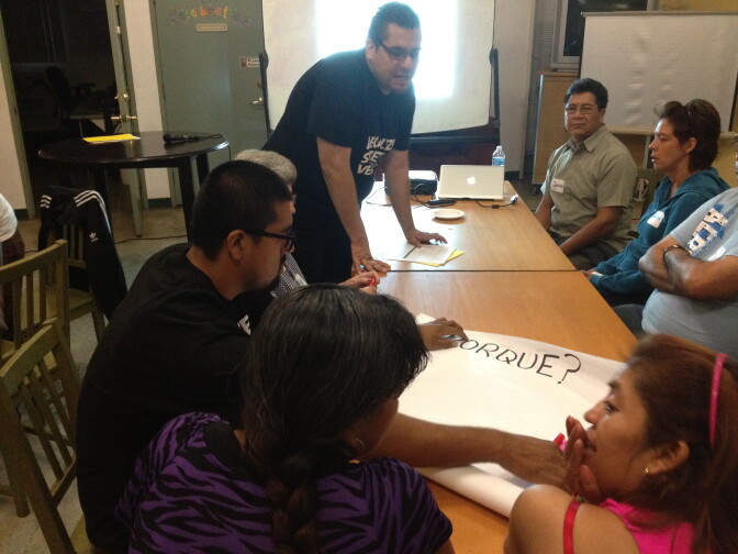 Street vendors from Highland Park break up into groups at one of the town hall meetings.