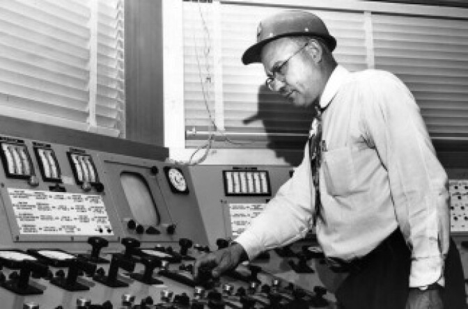 In this little seen photo, Theodore Filson, an engineer at the LA County Heatwave Generator cranks up the temperature in the LA Basin. Don't blame him, though. He gets his orders from the nation's air conditioner manufacturers, which operate state-of-the-art centers like these throughout the country.