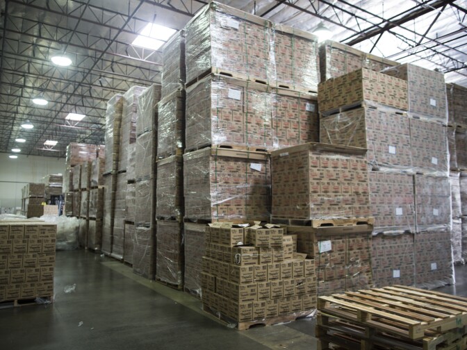 Empty glass containers await to be filled with hot sauce at Tapatio Foods in Vernon on Thursday morning, Jan. 14, 2016.