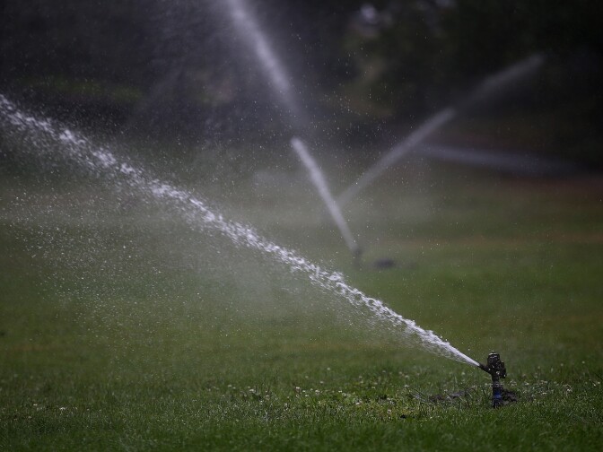 Sprinklers water a lawn in Golden Gate Park on July 15, 2014 in San Francisco, California. As the California drought continues to worsen and voluntary conservation is falling well below the suggested 20 percent, the California Water Resources Control Board is considering a $500 per day fine for residents who waste water on landscaping, hosing down sidewalks and car washing.  