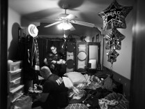 Riverside police officers look through the room of a probationer who had recently gone missing and has gang ties in Los Angeles.