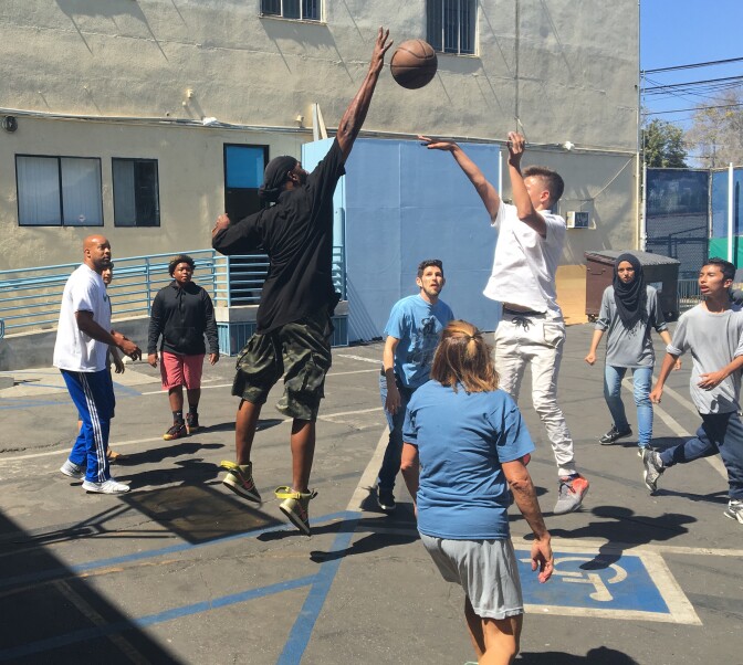 Students at City High School, a now-shuttered charter school in the Pico-Robertson neighborhood of Los Angeles, play basketball against their teachers during one of the school's final days in operation.
