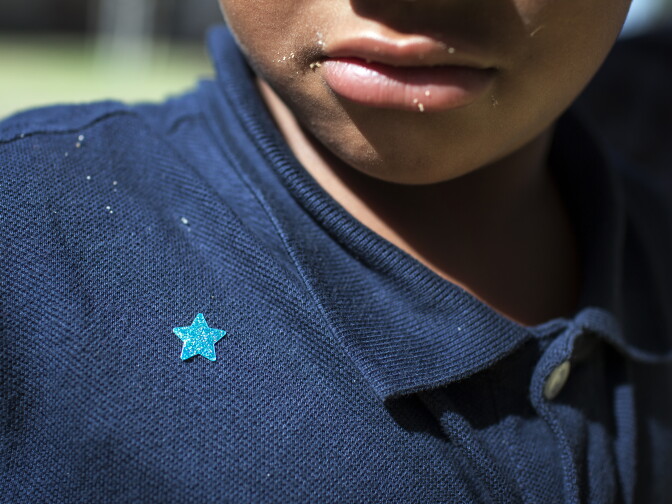 Kindergartener Thomas Harris received a star for helping teacher Cherie Wood at Willard Elementary School in Pasadena, two weeks into the school year, on Wednesday morning, Aug. 31, 2016.