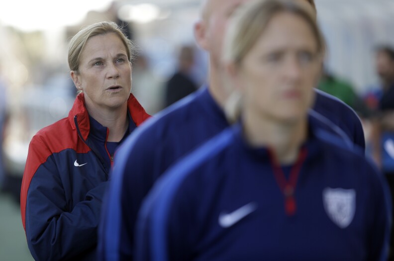 Head coach Jill Ellis, of the US, sings the national anthem prior the women's soccer Algarve Cup final match between US and France at the Algarve stadium, outside Faro, southern Portugal, Wednesday, March 11, 2015. US defeated France 2-0 and won the cup. 