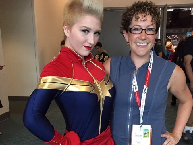 Perlman poses with an unnamed cosplayer dressed as the current version of Captain Marvel.
