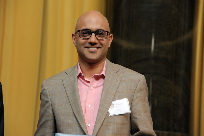 NEW YORK, NY - MAY 30:  Lee C. Bollinger presents an award to Ayad Akhtar   at  the 7th Annual Pulitzer Prizes in Journalism, Letters, Drama and Music Winners LuncheonColumbia University on May 30, 2013 in New York City.  (Photo by Dave Kotinsky/Getty Images)