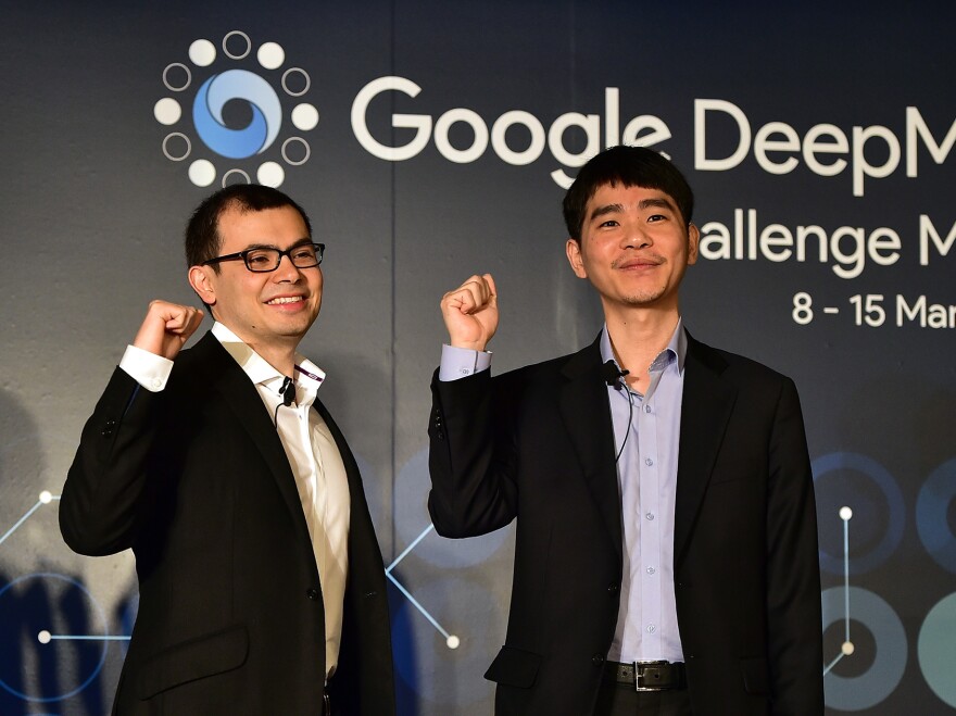 South Korean Go champion Lee Sedol (right) poses with Google DeepMind head Demis Hassabis. On Wednesday, Sedol will begin a five-match series against a computer.