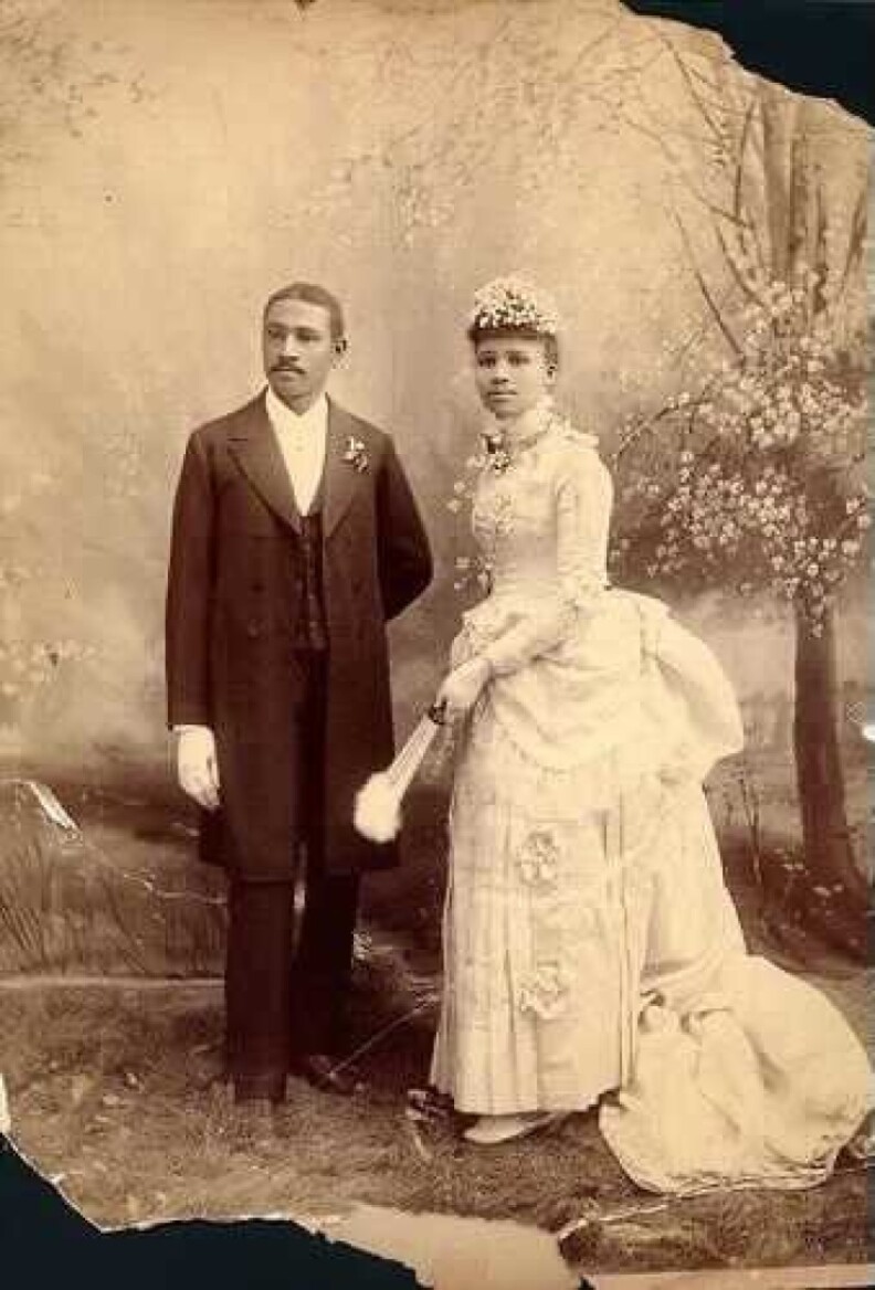 An archival image of Charles in Willie Bruce photographed in elegant suit and dress, respectively.
