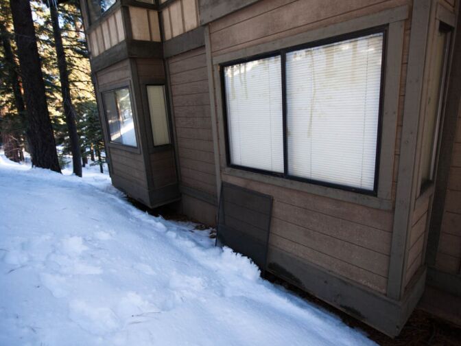 A screen had been removed from the back of Unit 203 at the condo where Christopher Dorner holed up from the police.