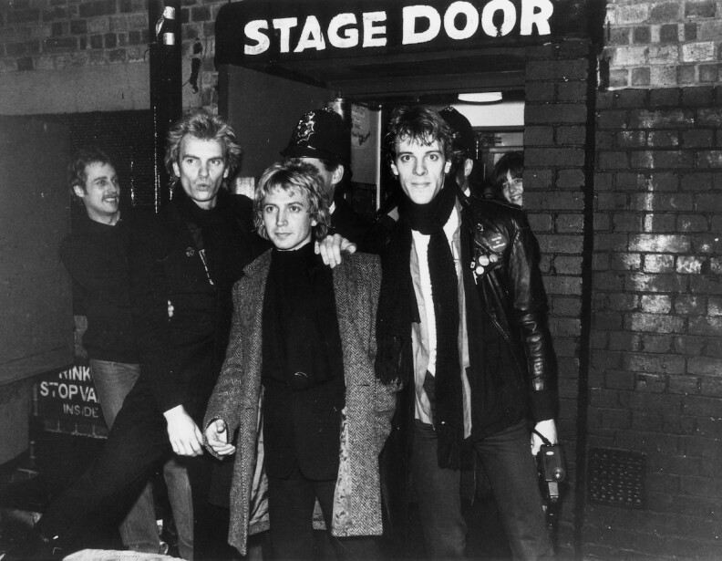 Police the band in front of a stage door