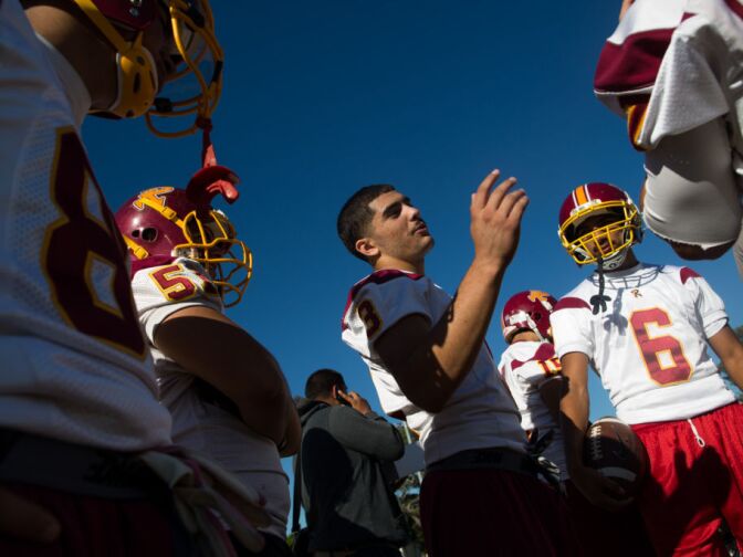 Gilbert Herrera, center, plays running back, safety, cornerback, punts and is a quarterback for Roosevelt high school. He was also named Homecoming king.