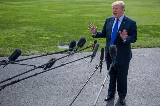 US President Donald Trump speaks as he departs the White House in Washington, DC, on October 2, 2018. (Photo by Jim WATSON / AFP)        (Photo credit should read JIM WATSON/AFP/Getty Images)