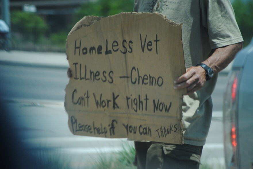 This guy is out at the southbound 1-25/Colorado Blvd. exit, <i>all the time</i> when the weather is warm. I definitely wouldn't want to be out there all day. 

