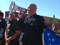 Water board candidate and white supremacist Jeff Hall (with bullhorn) at an anti-illegal immigration rally in Riverside last year.