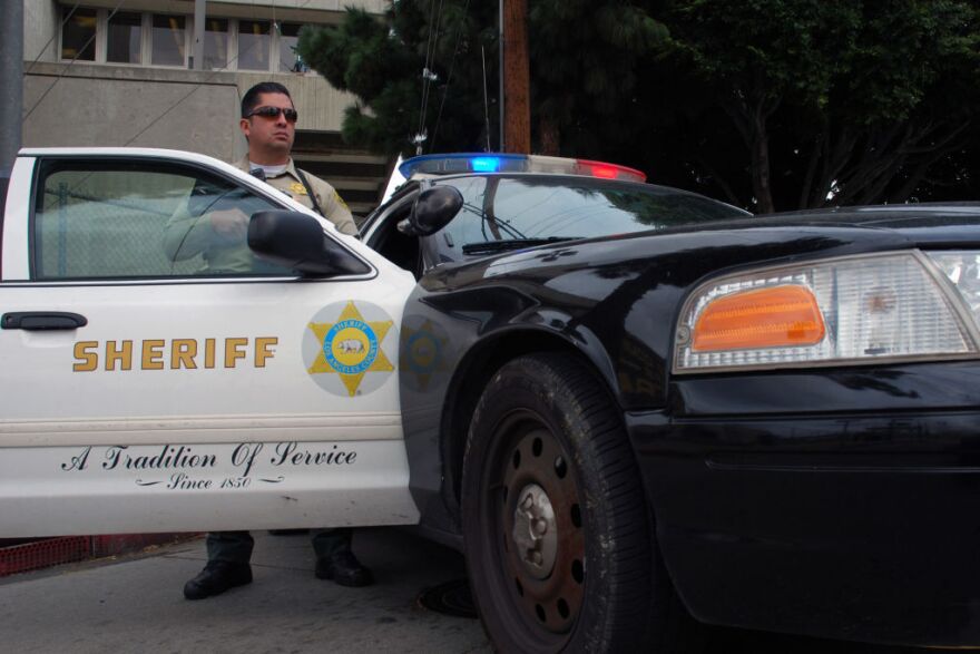 Sheriff's Deputy Rodriguez, an officer from the Los Angeles County Sheriff's Department, guards an intersection outside the Twin Towers Correctional Facility in Los Angeles on Feb. 8, 2013, following reports that murder suspect Christopher Dorner was seen in the area. The correctional facility and adjoining L.A. County Men's Central Jail were on high alert after the report, resulting in area traffic checkpoints conducted by officers in ballistic vests and helmets.