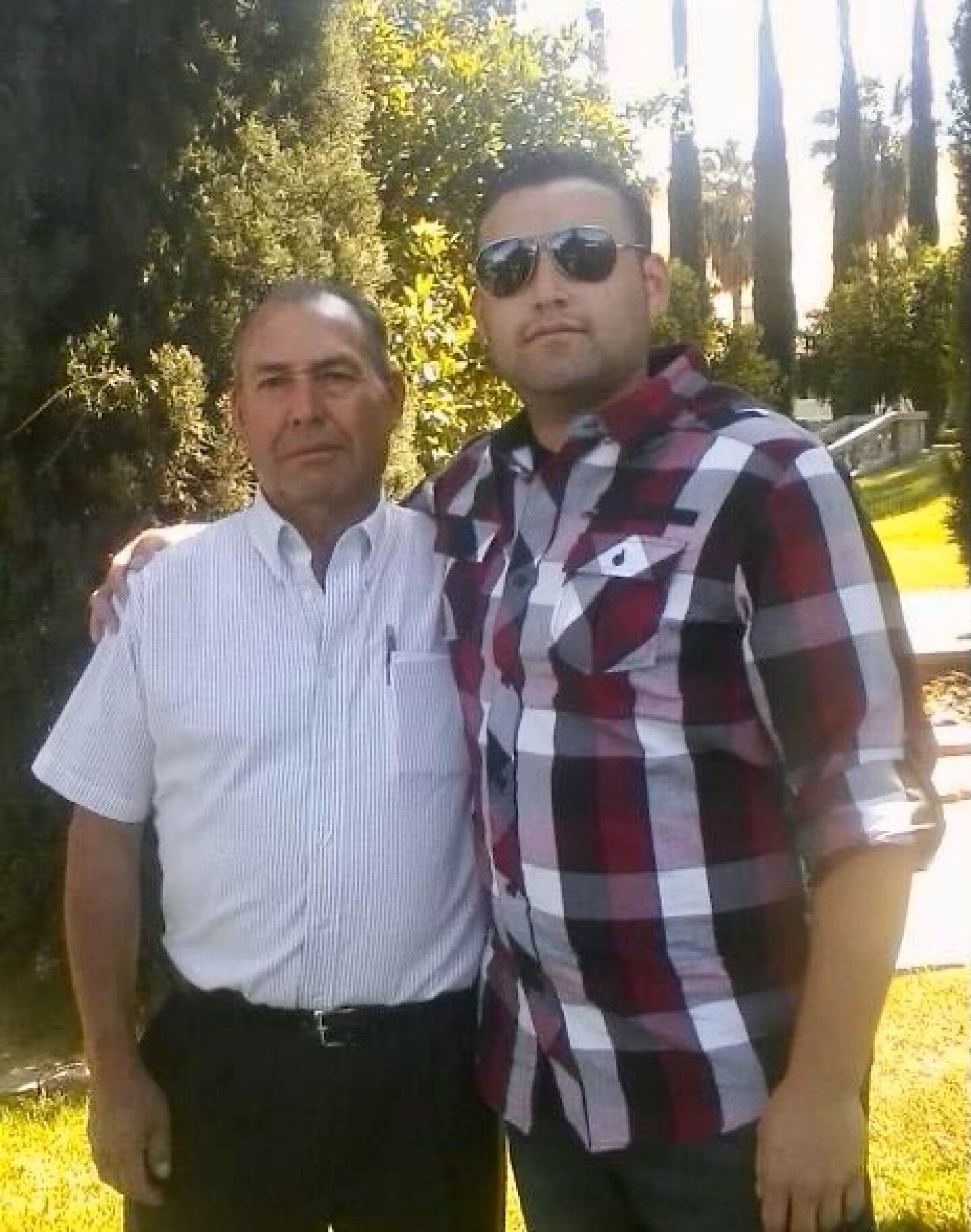 David Ordaz, Sr. stands next to son David Ordaz, Jr.