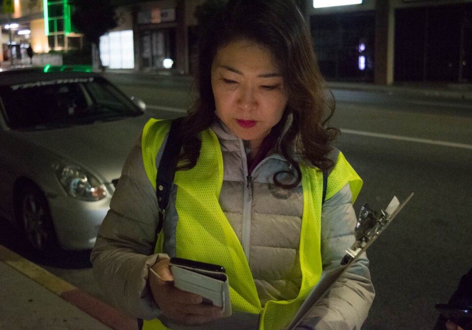 Hyepin Im reviews the tally form for the 2018 Koreatown Homeless Count during her volunteer shift the evening of Jan. 25, 2018. Volunteers traveled in small groups to collect accurate data on the homeless population in different census tracts.
