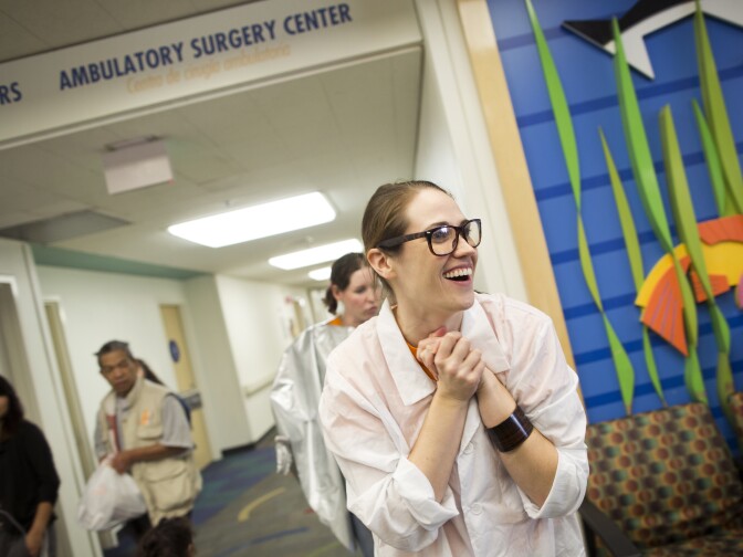 Scarlett Redmond is an actress with the Zimmer Children's Museum. Redmond and her partner, Katie Curley, perform a skit on Monday, Feb. 23, 2015 in the AltaMed outpatient waiting room at Children's Hospital Los Angeles. The partnership with Zimmer Children's Museum is part of the non-clinical side of the hospital's arts offerings. 