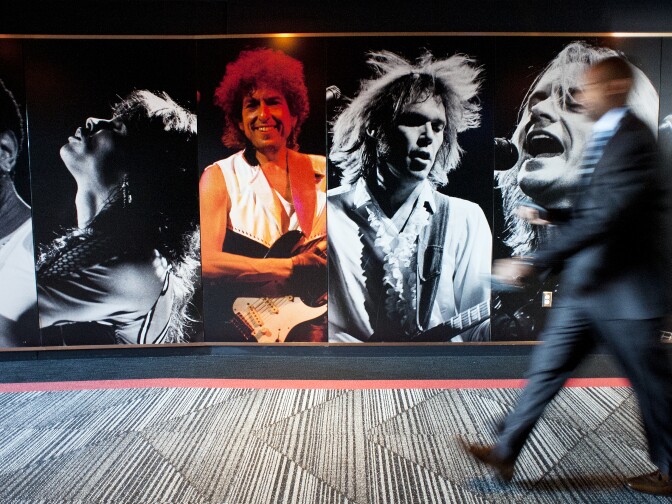 Archival concert photos are on display in one of the entrances to the newly renovated Forum.